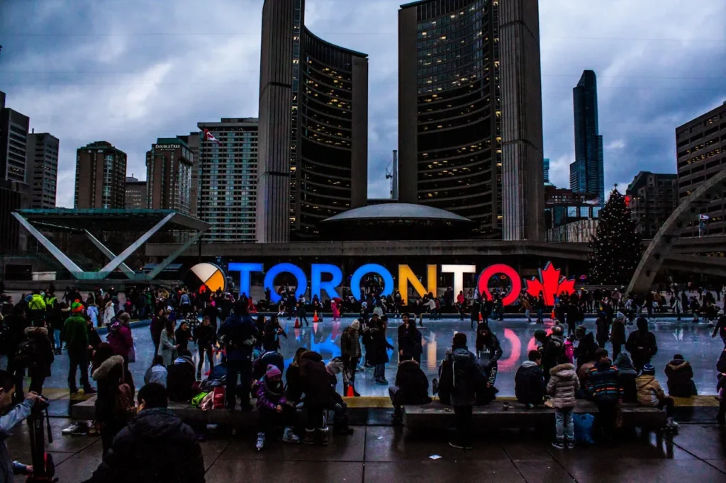 Toronto-Canada-People-Gathered-in-Front-of-Toronto-Freestanding-Signage