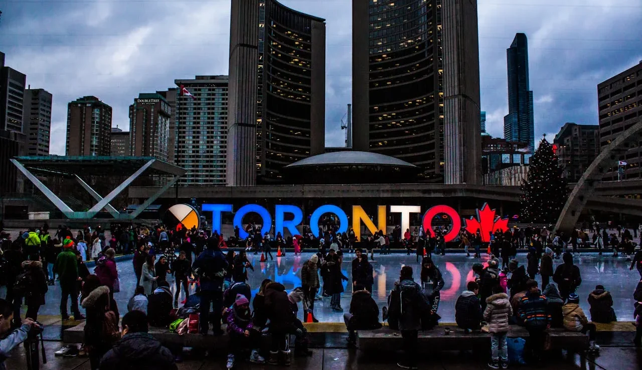 Toronto-Canada-People-Gathered-in-Front-of-Toronto-Freestanding-Signage